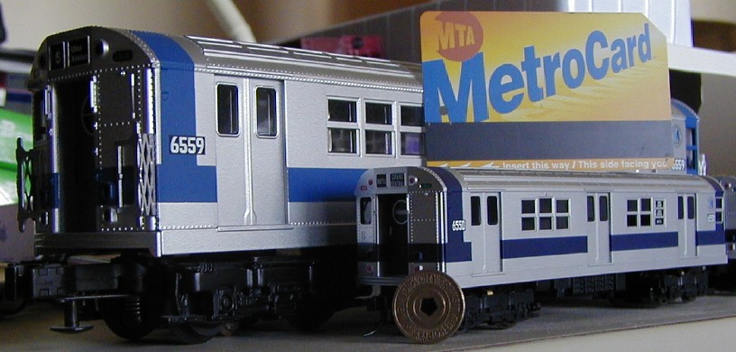 Model cars with real MetroCard and token